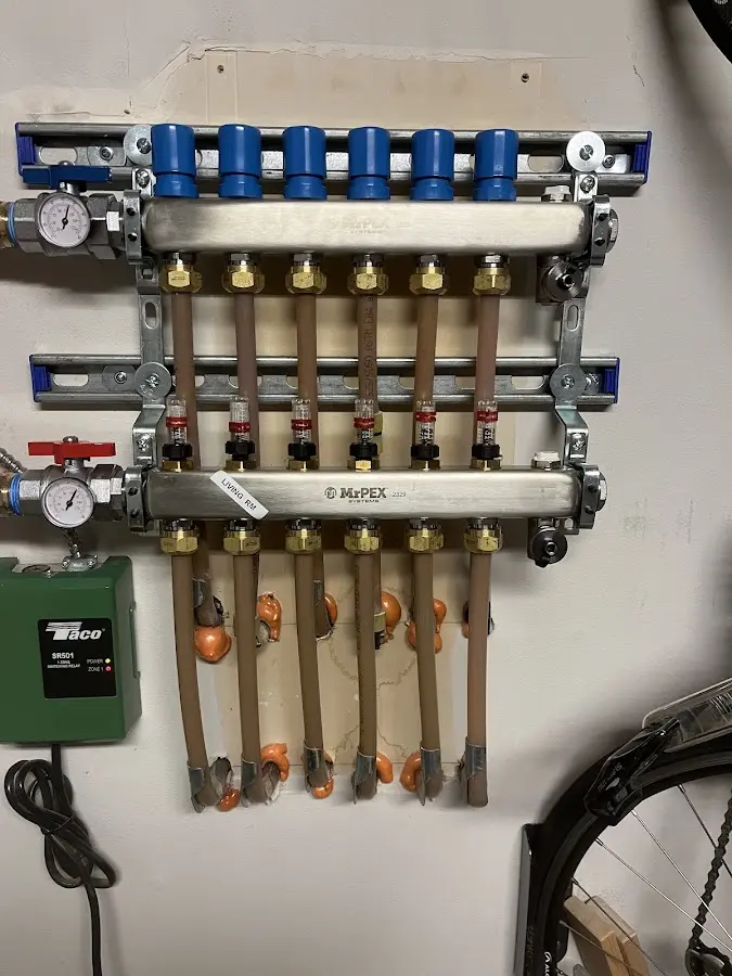 Plumber performing Water Heater Repair at a residential property in Northport